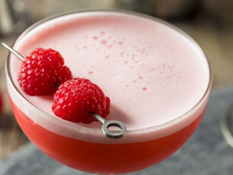 clover club cocktail with fresh raspberries