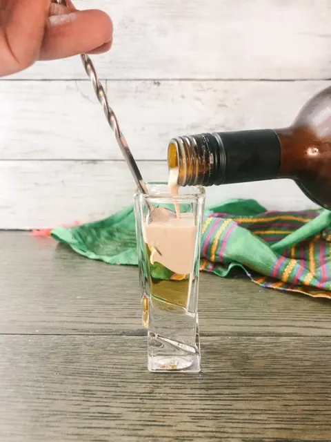 Pour your Bailey's into the shot glass to make your buttery nipple